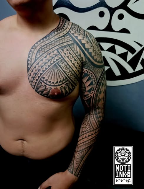 Polynesian blackwork chest and full-sleeve tattoo by Miguel Lagbas / MOTI INK
